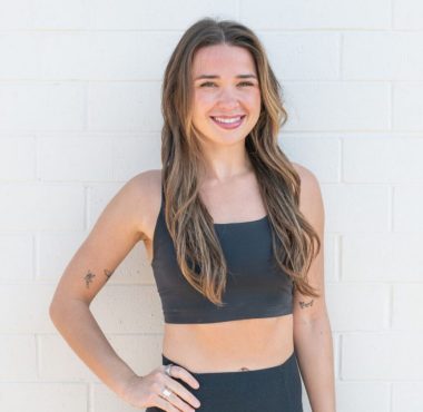 Smiling woman in black athletic wear