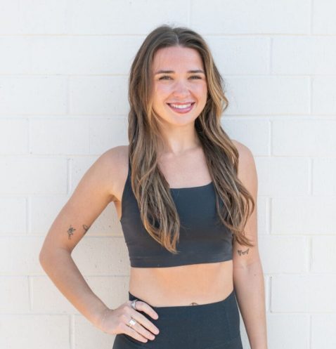 Smiling woman in black athletic wear