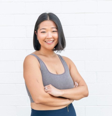 Short bob haircut smiling with arms crossed