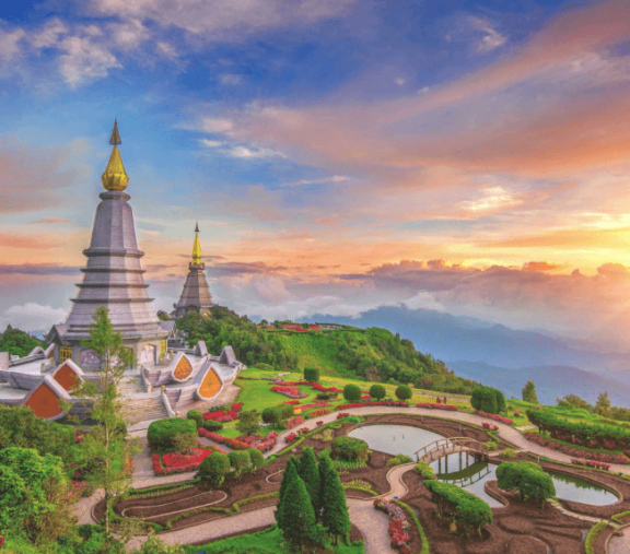 Pagodas on mountain with colorful sunset.