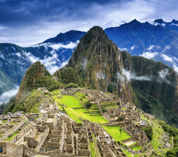 Machu Picchu ruins with mountain backdrop.