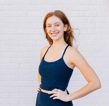 Young woman in navy tank top smiling